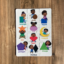 15-piece diversity-themed children's jigsaw puzzle featuring colorful geometric shapes in primary colors. Educational puzzle for ages 3–6 that supports shape recognition, early geometry learning, and fine motor skill development.