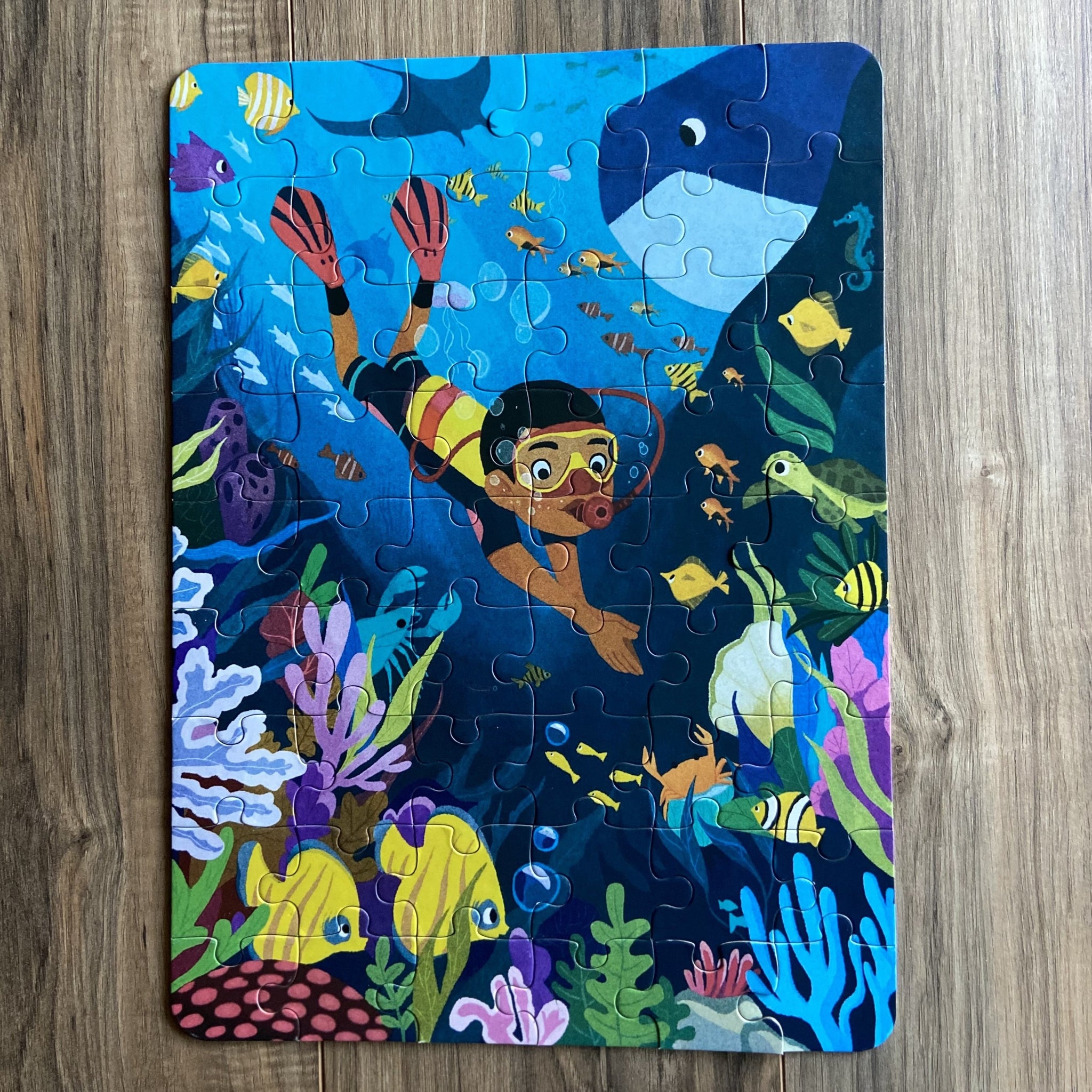 Puzzle of a Black boy diving in the ocean